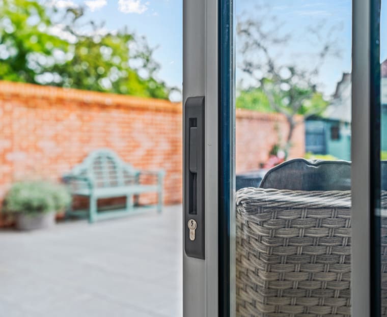 Locking mechanism to sliding patio door.