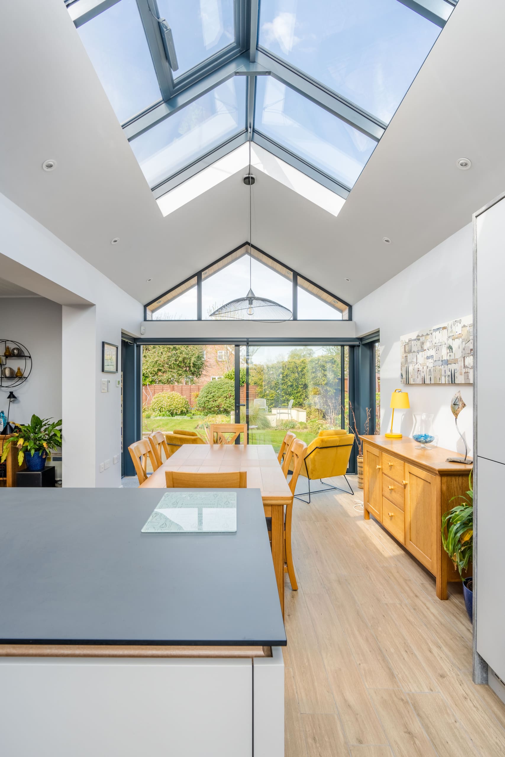 Interior of a stunning kitchen diner with roof lantern.