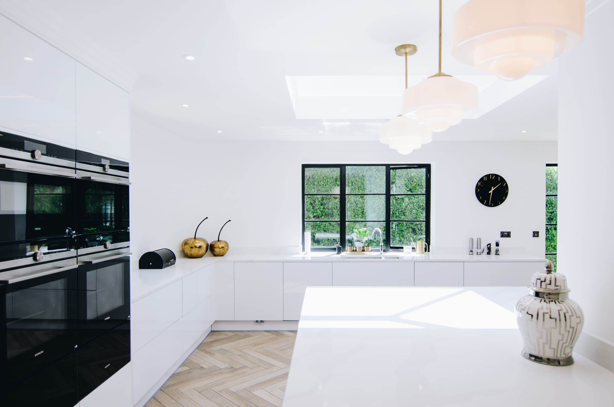 Beautiful art deco property with aluminium windows to complement the white kitchen space.