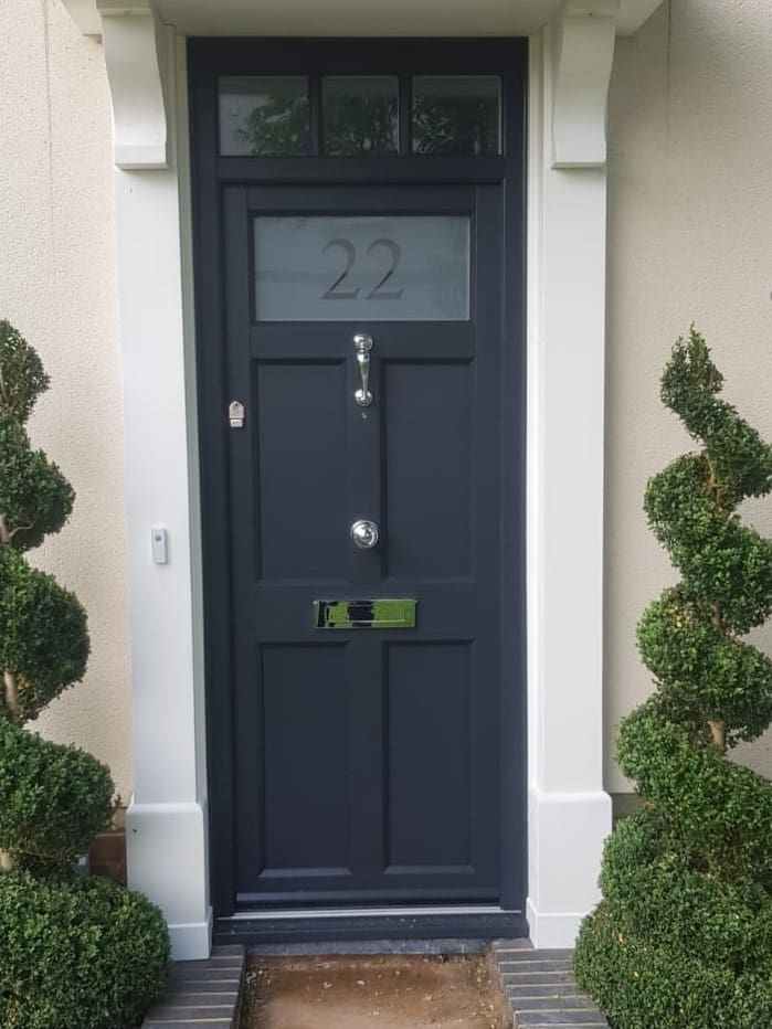 Traditional front door in charcoal grey.