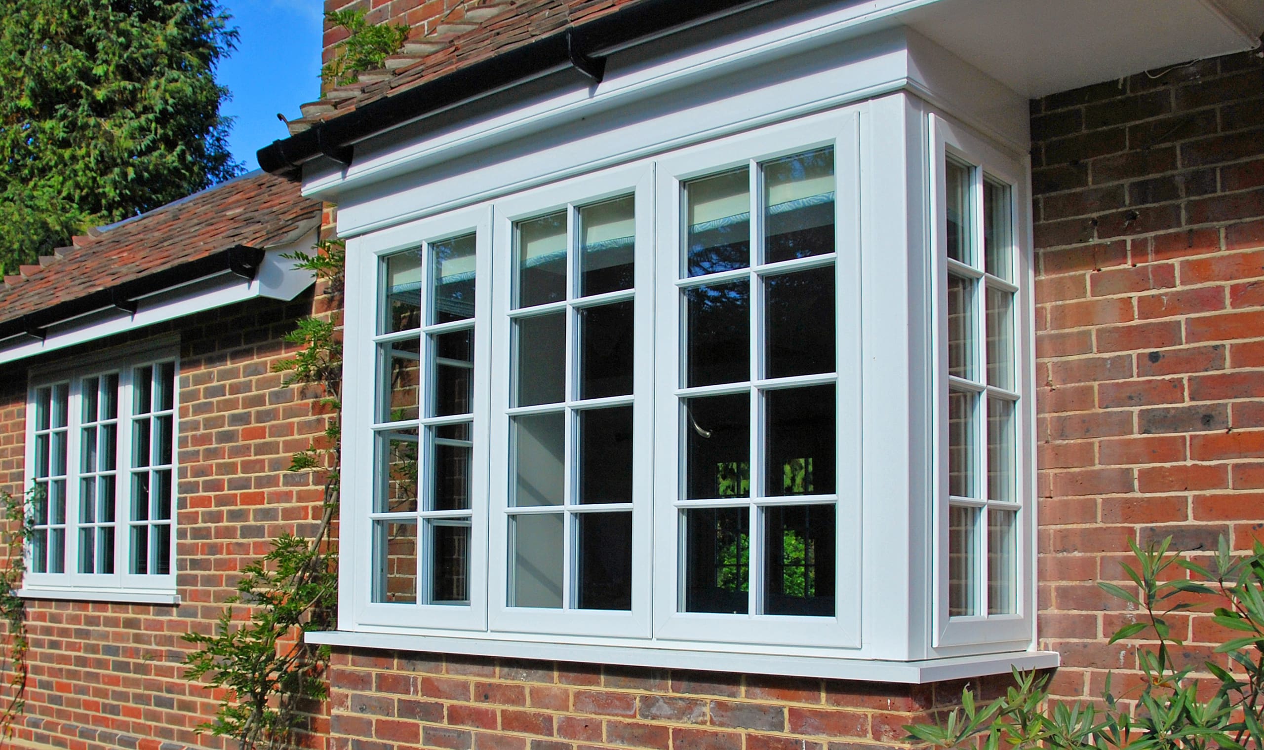 Bay window finished with traditional style modern windows.