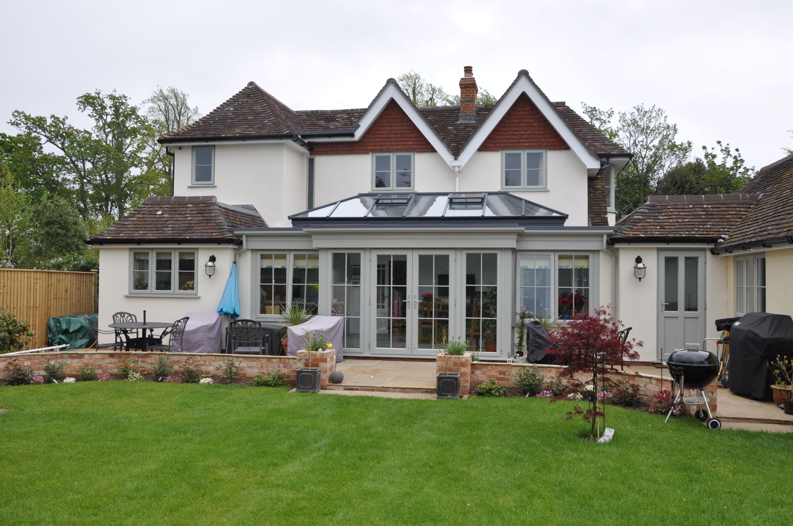 Substantial home with orangery extension and roof lantern.