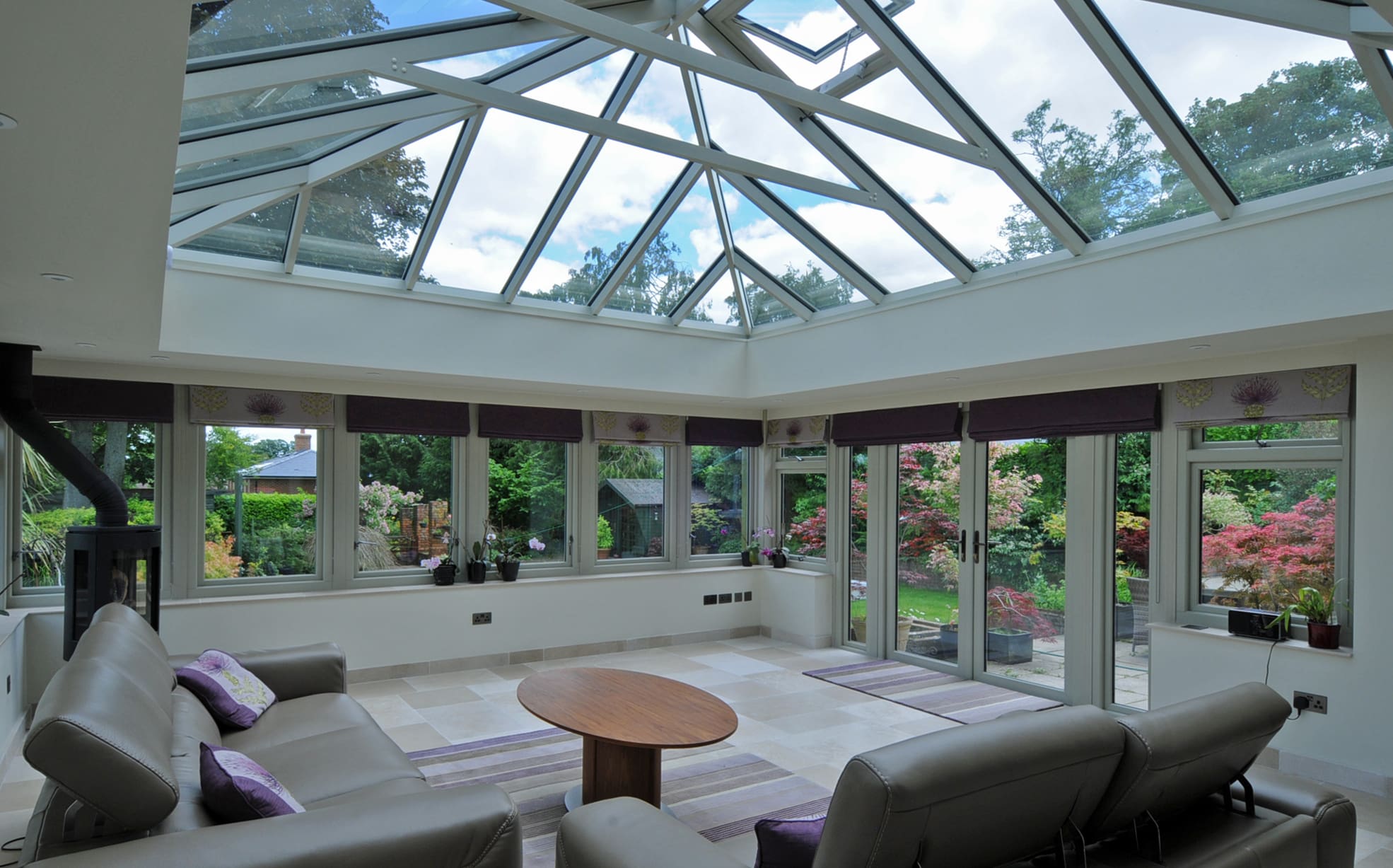 Beautiful lounge with large roof lantern and dual aspect windows and french doors.