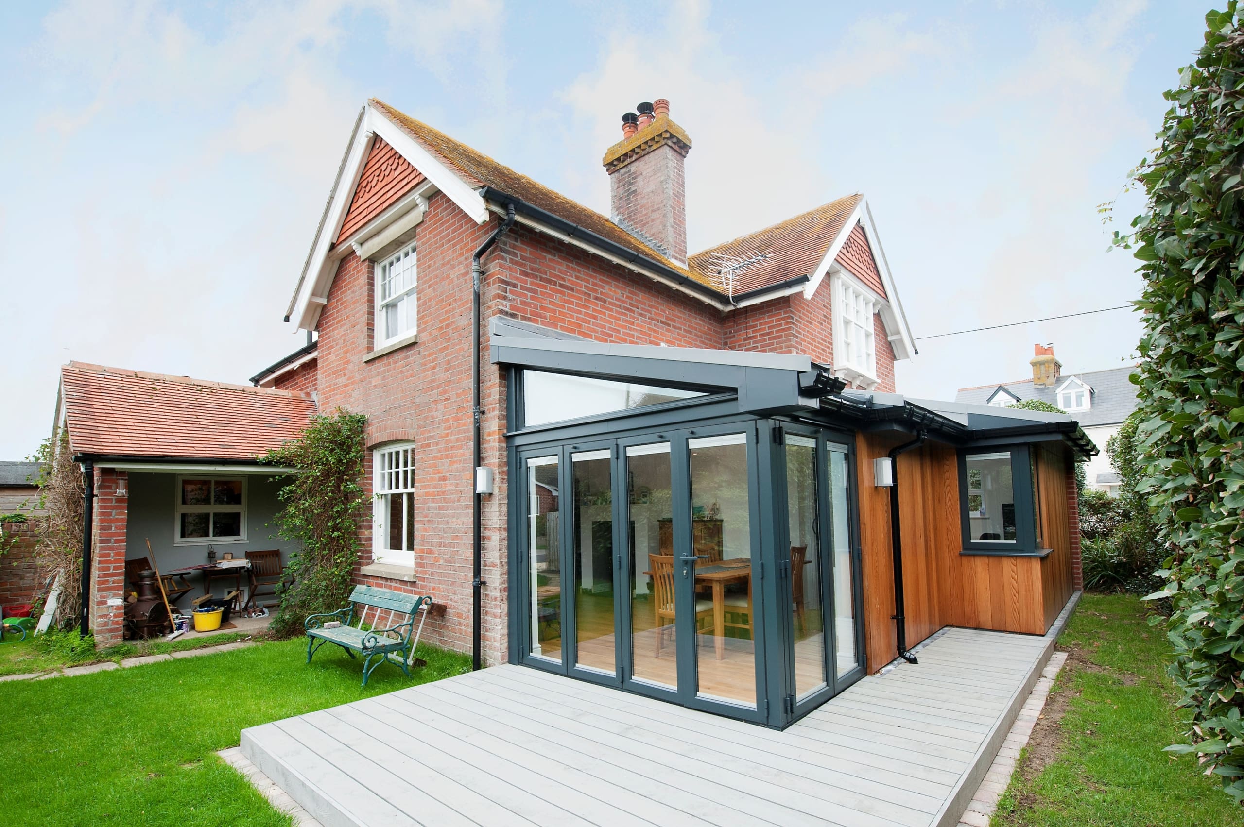 Bifolding door to rear of a house with garden view.