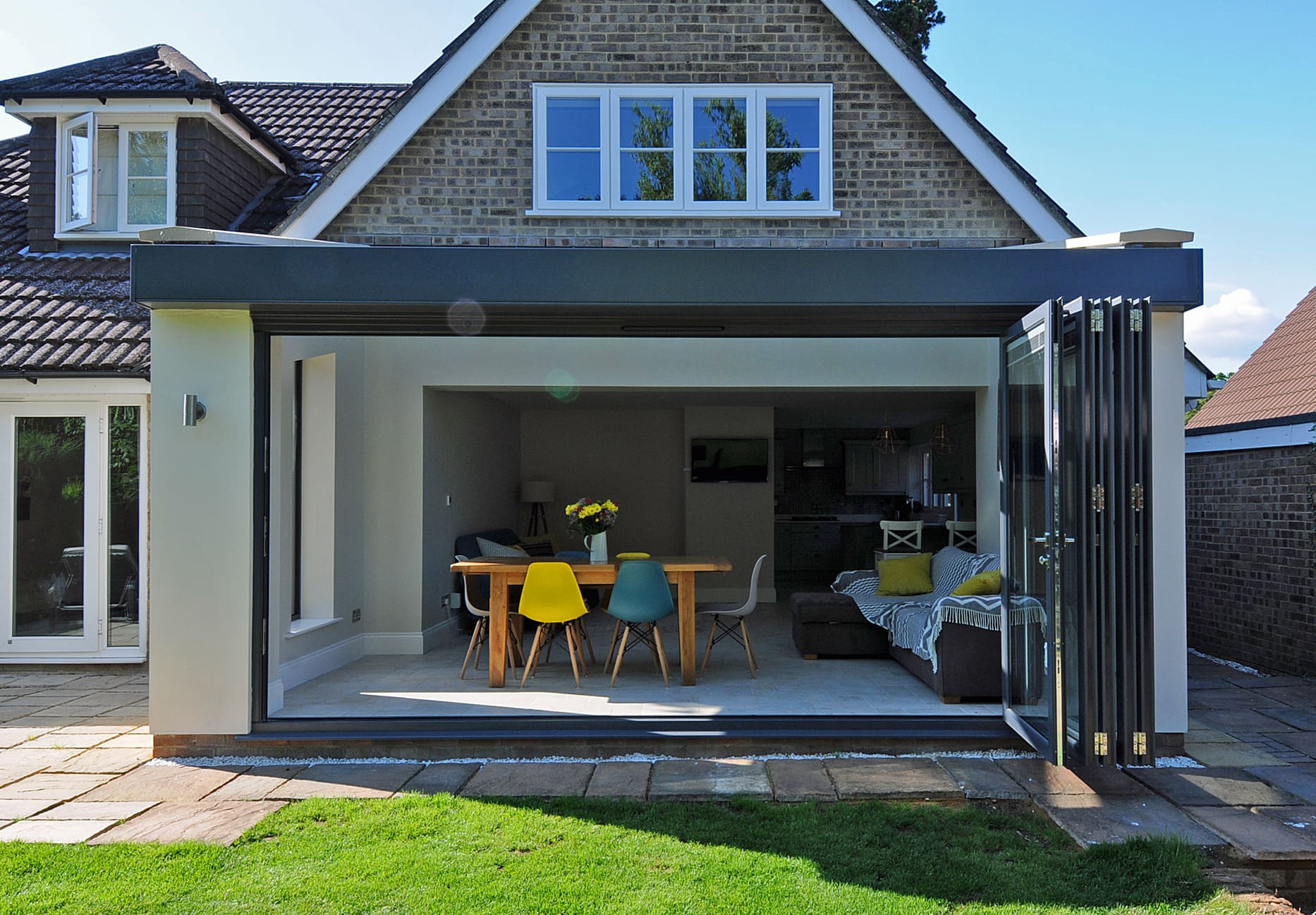 Modern home with dining area extension with bi-folding doors and roof light.