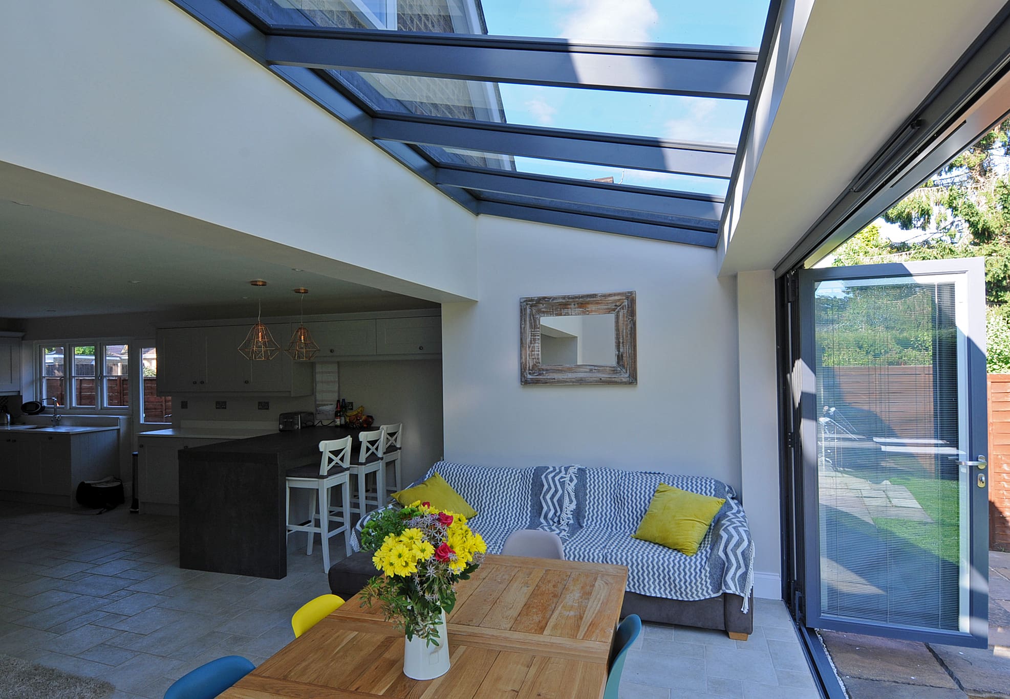 Modern home with dining area extension with bi-folding doors and roof light.