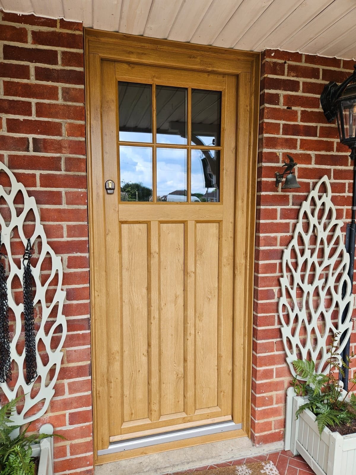 Evolution Oak boxmore door with red brick surround.