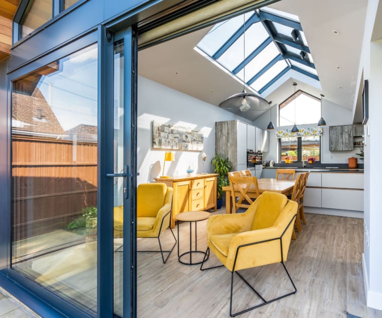 Kitchen extension with roof lantern and modern sliding doors.