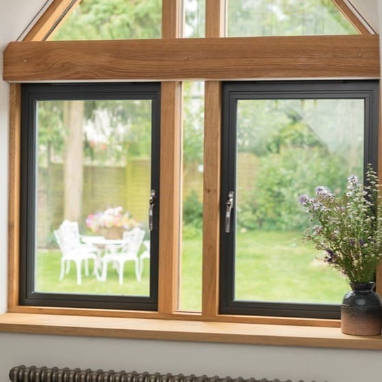 Origin windows with timber framework overlooking a country garden.