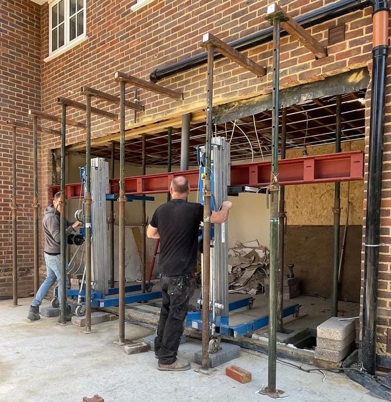 Walls being prepared for the installation of full-length windows and doors