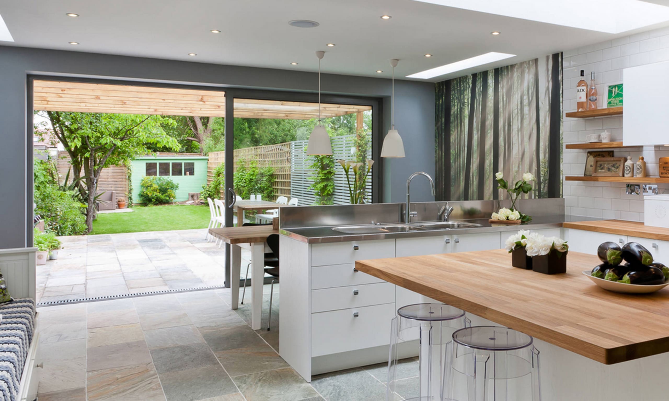 Beautiful modern kitchen with modern sliding aluminium doors.