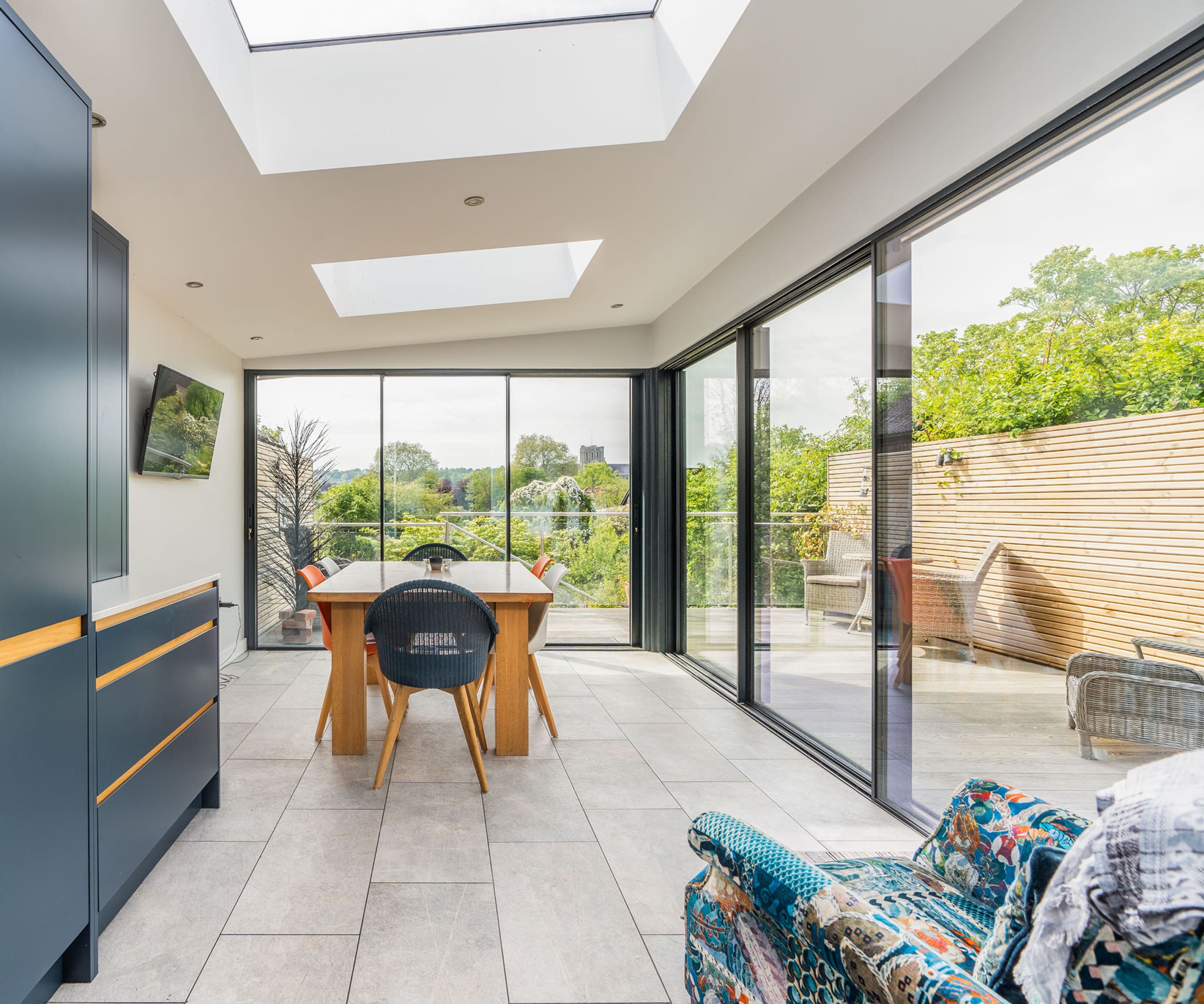 Beautiful kitchen extension with roof lantern and sliding doors.